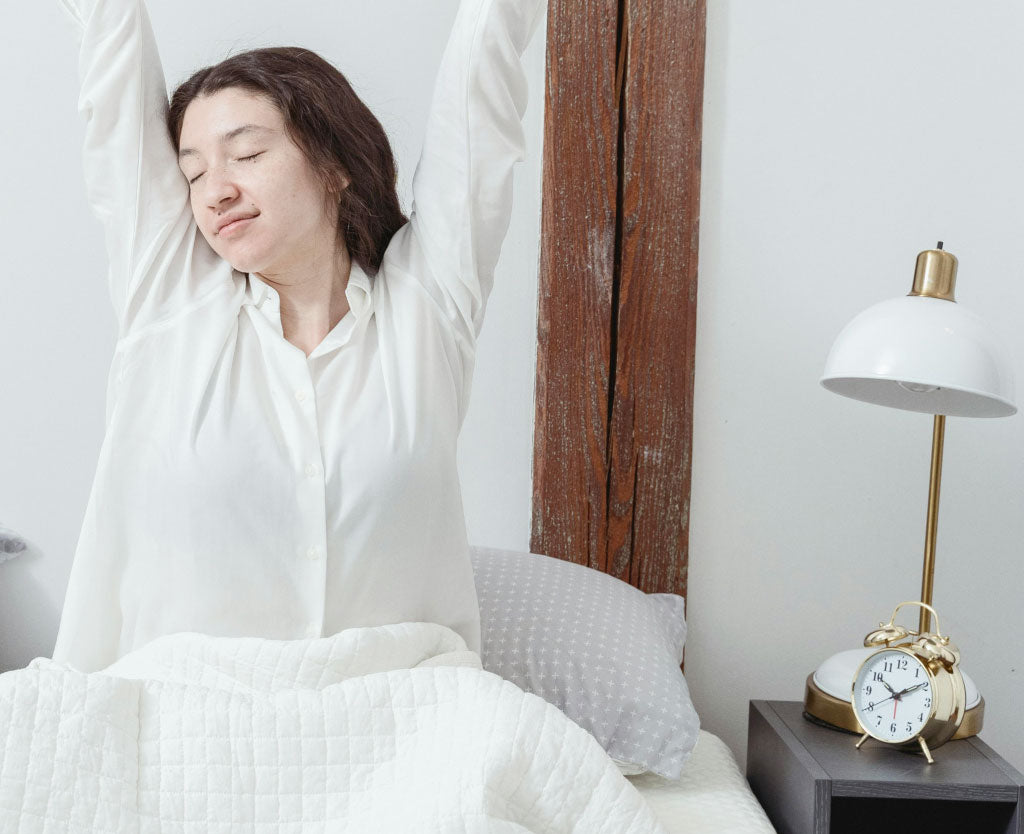 Woman Stretching In Bed