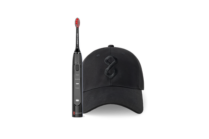 Black cap with logo and a black electric toothbrush